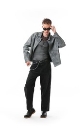 Photo of Handsome young man wearing stylish jacket and sunglasses on white background