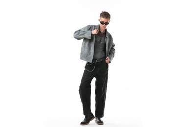 Photo of Handsome young man wearing stylish jacket and sunglasses on white background