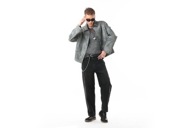Photo of Handsome young man wearing stylish jacket and sunglasses on white background