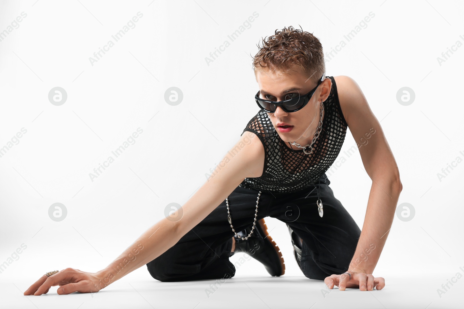 Handsome young man wearing sunglasses on white background Photo of Handsome young man wearing sunglasses on white background