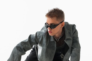 Photo of Handsome young man wearing stylish jacket and sunglasses on white background