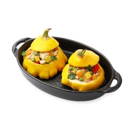 Photo of Tasty stuffed pattypan squashes in baking dish isolated on white