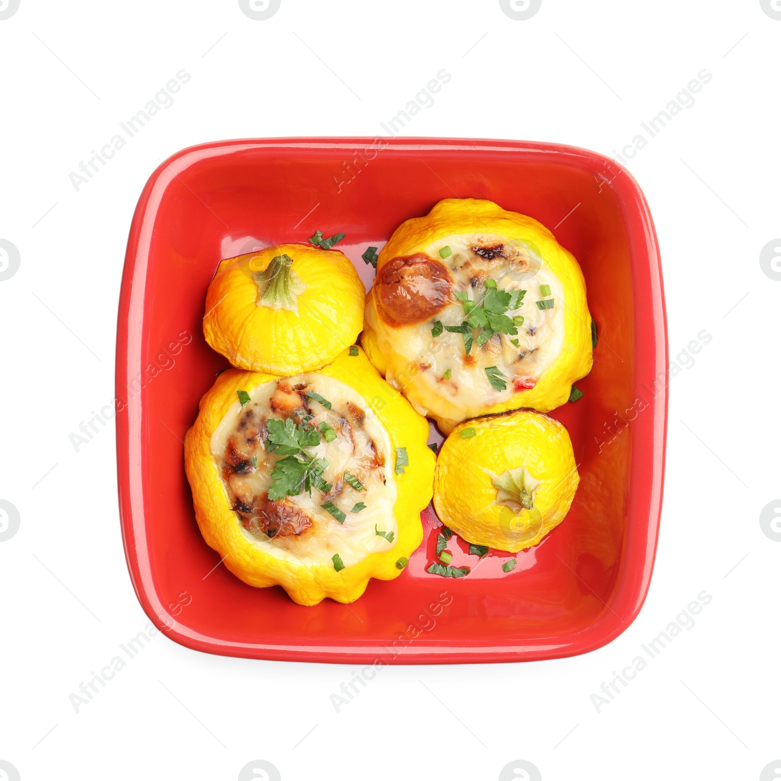 Tasty stuffed pattypan squashes in baking dish isolated on white, top view Photo of Tasty stuffed pattypan squashes in baking dish isolated on white, top view