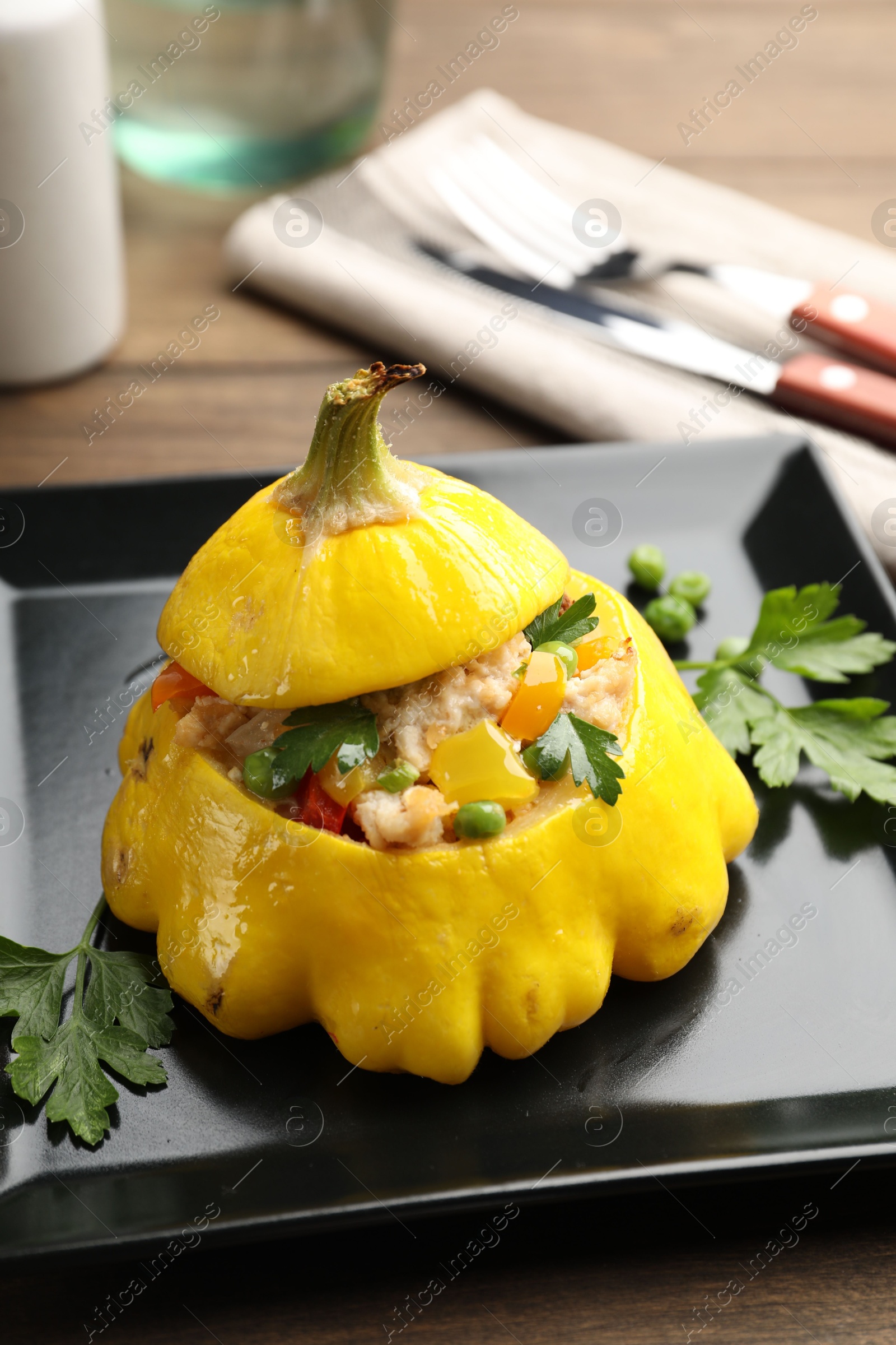 Tasty stuffed pattypan squash on wooden table, closeup Photo of Tasty stuffed pattypan squash on wooden table, closeup