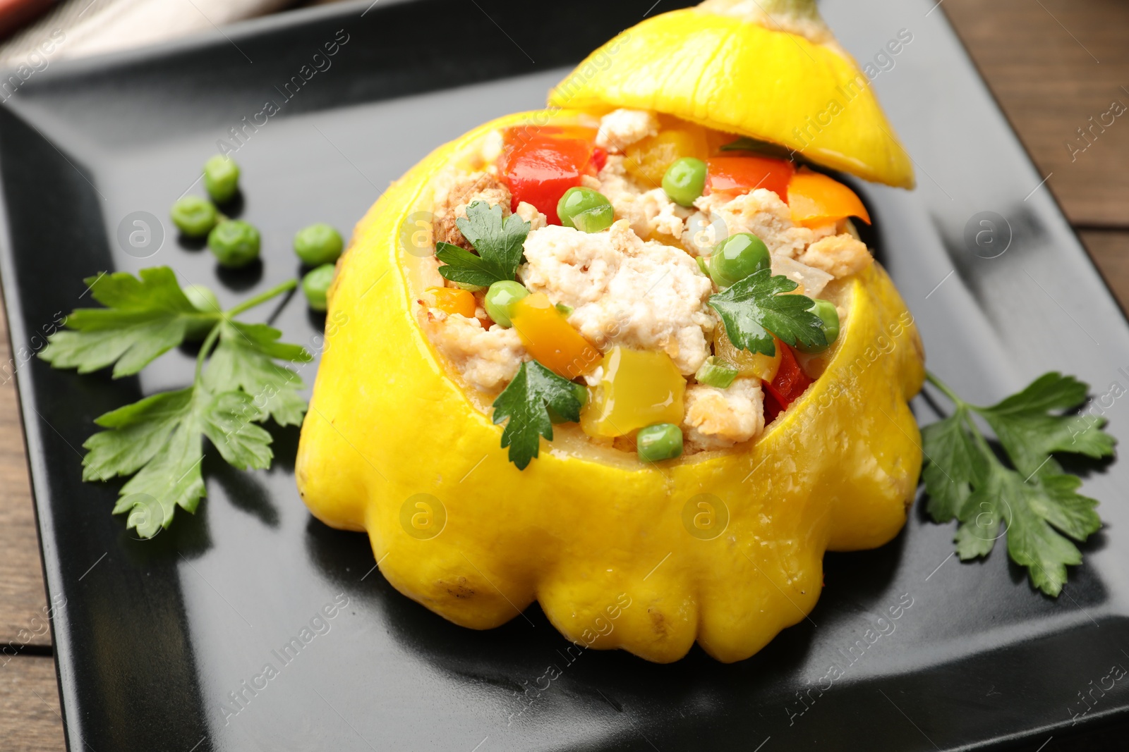 Tasty stuffed pattypan squash on wooden table, closeup Photo of Tasty stuffed pattypan squash on wooden table, closeup
