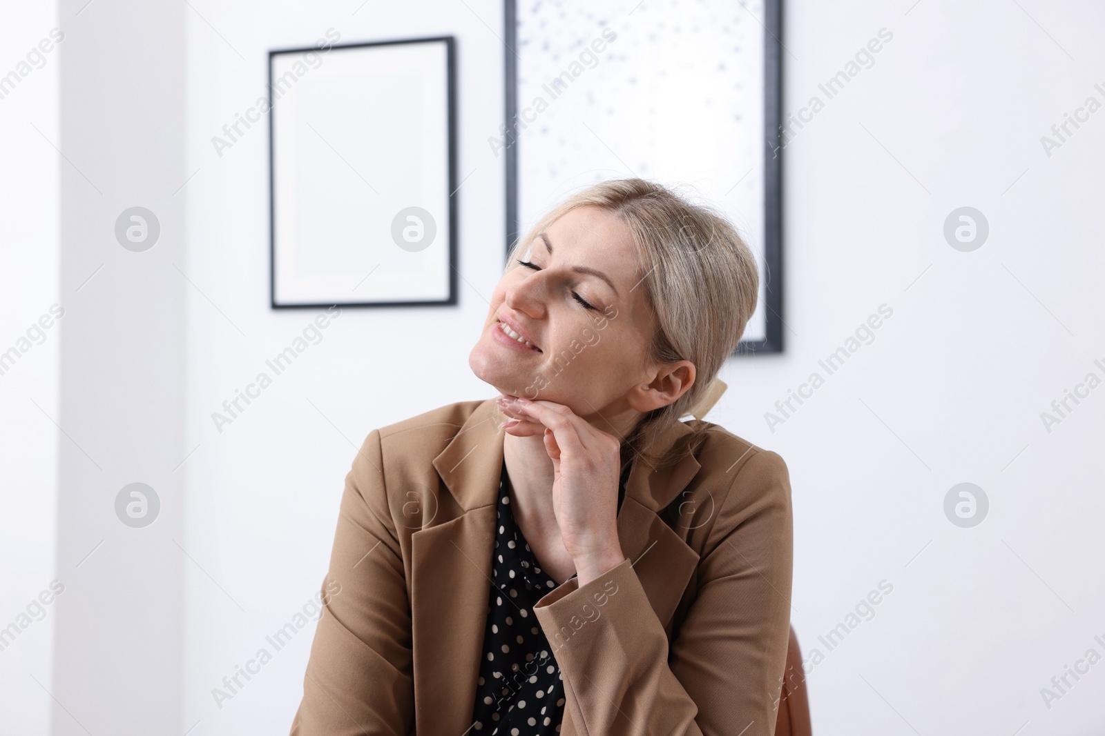 Dreams come true. Happy woman thinking about something indoors Photo of Dreams come true. Happy woman thinking about something indoors