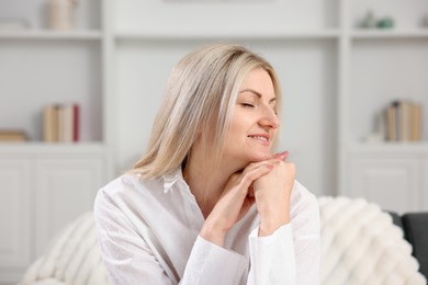 Photo of Dreams come true. Woman thinking about something at home