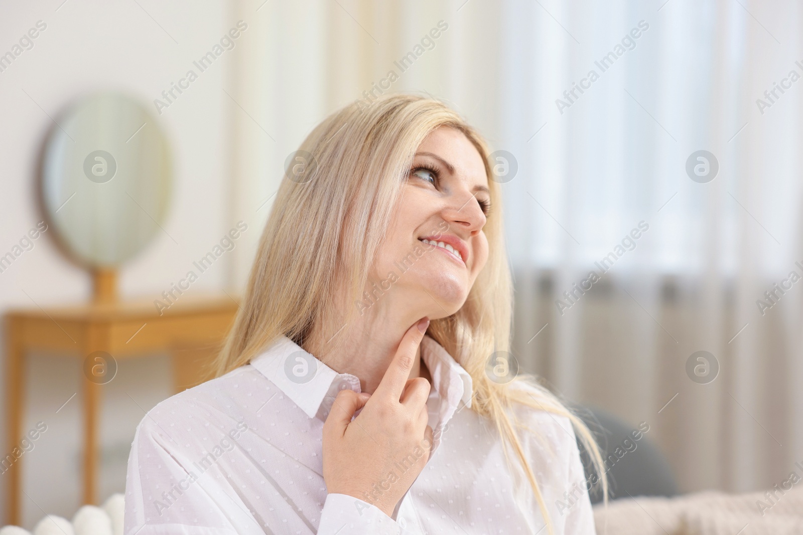 Dreams come true. Woman thinking about something at home Photo of Dreams come true. Woman thinking about something at home