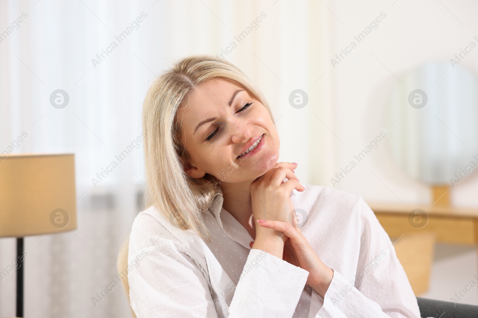 Dreams come true. Woman thinking about something at home Photo of Dreams come true. Woman thinking about something at home