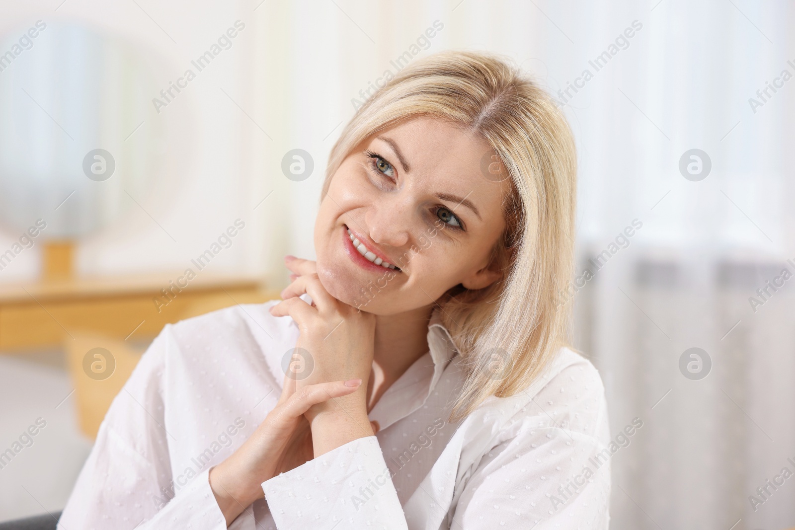 Dreams come true. Woman thinking about something at home Photo of Dreams come true. Woman thinking about something at home