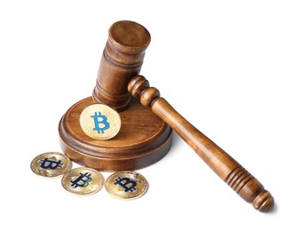 Photo of Cryptocurrency. Bitcoins and judge's gavel isolated on white