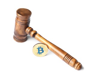 Photo of Cryptocurrency. Bitcoin and judge's gavel isolated on white
