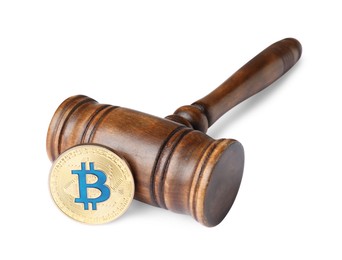 Photo of Cryptocurrency. Bitcoin and judge's gavel isolated on white