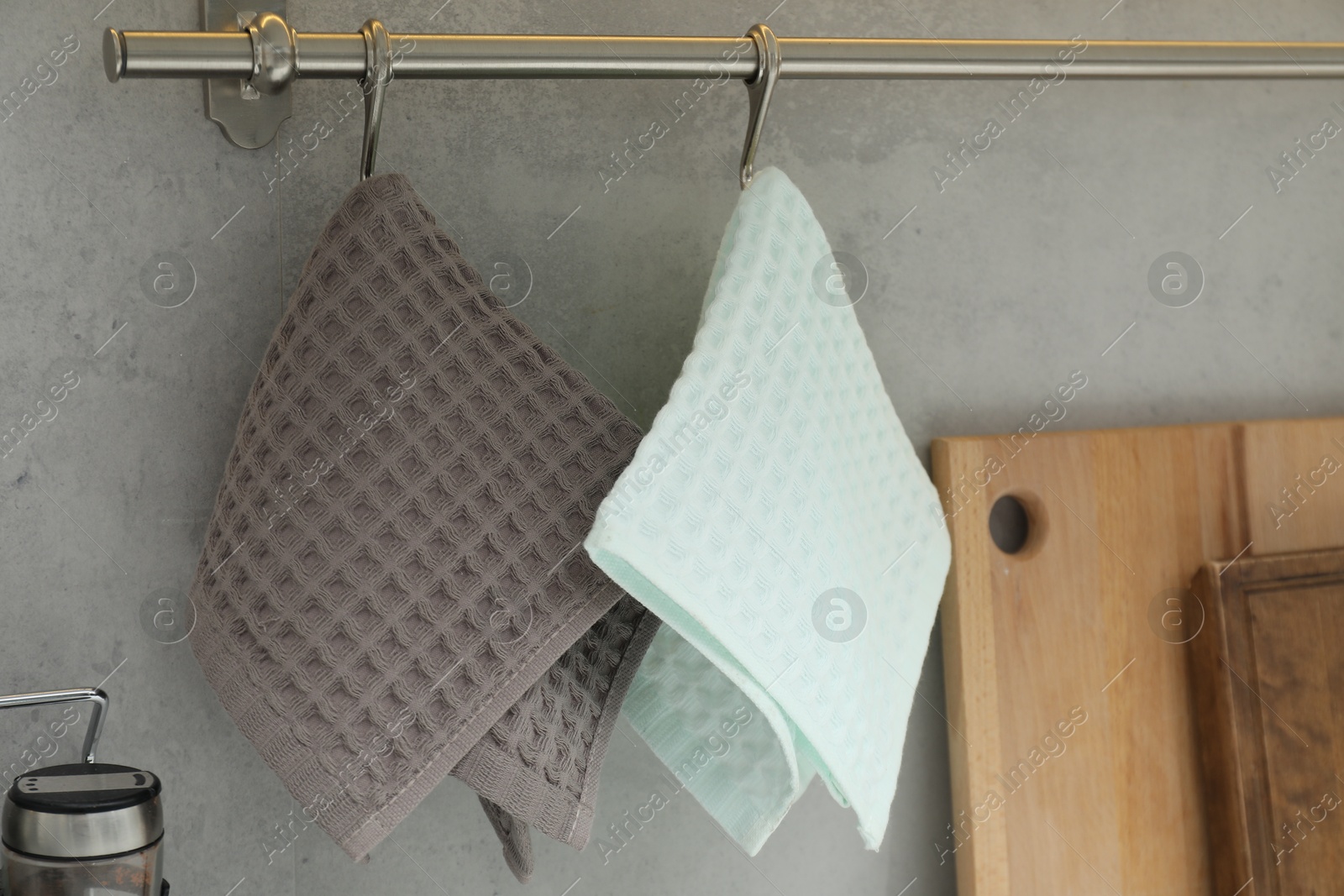 Clean waffle towels hanging in kitchen, closeup Photo of Clean waffle towels hanging in kitchen, closeup
