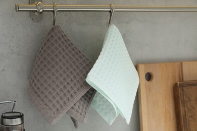 Photo of Clean waffle towels hanging in kitchen, closeup