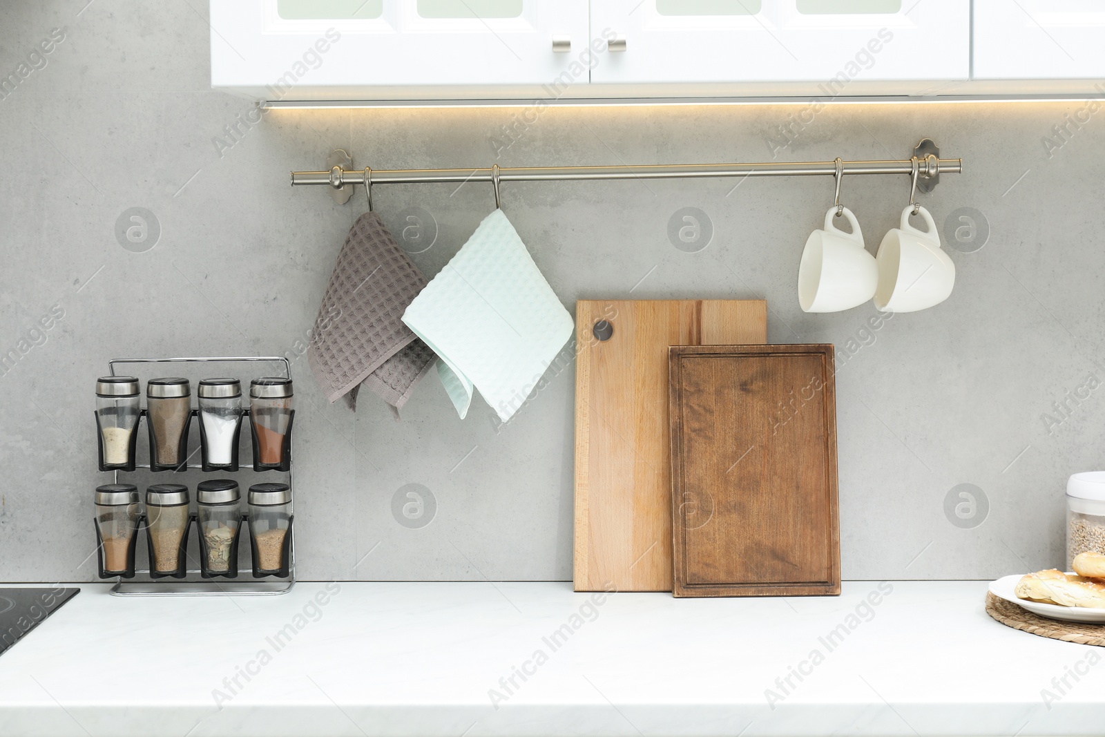 Clean waffle towels, cups, cutting boards and spices in kitchen Photo of Clean waffle towels, cups, cutting boards and spices in kitchen