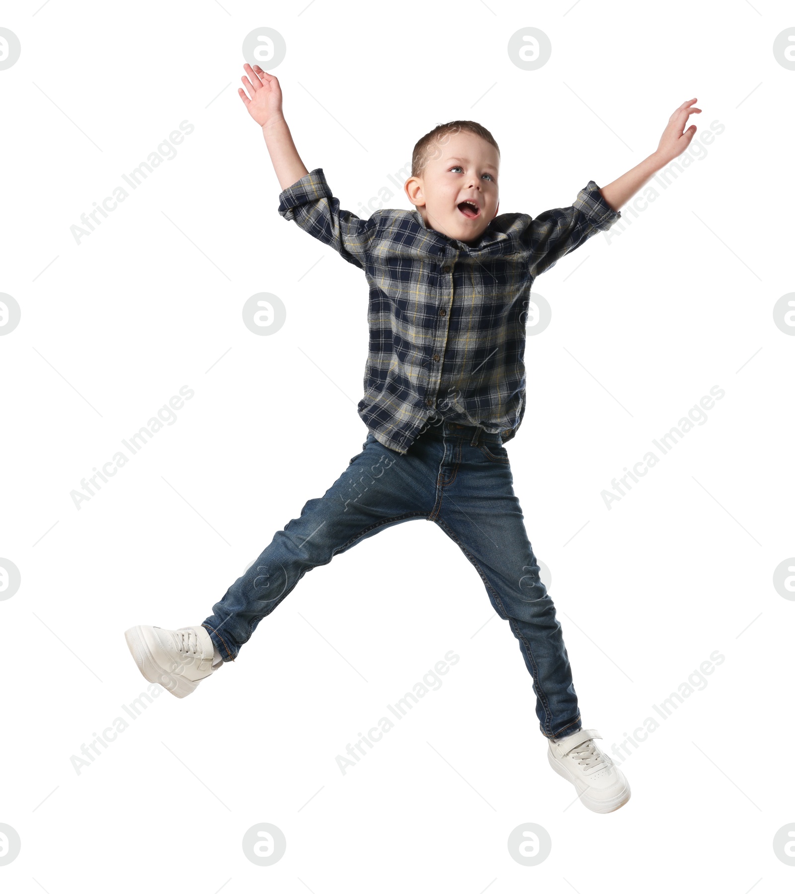 Cute little boy jumping on white background Photo of Cute little boy jumping on white background