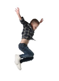 Photo of Cute little boy jumping on white background