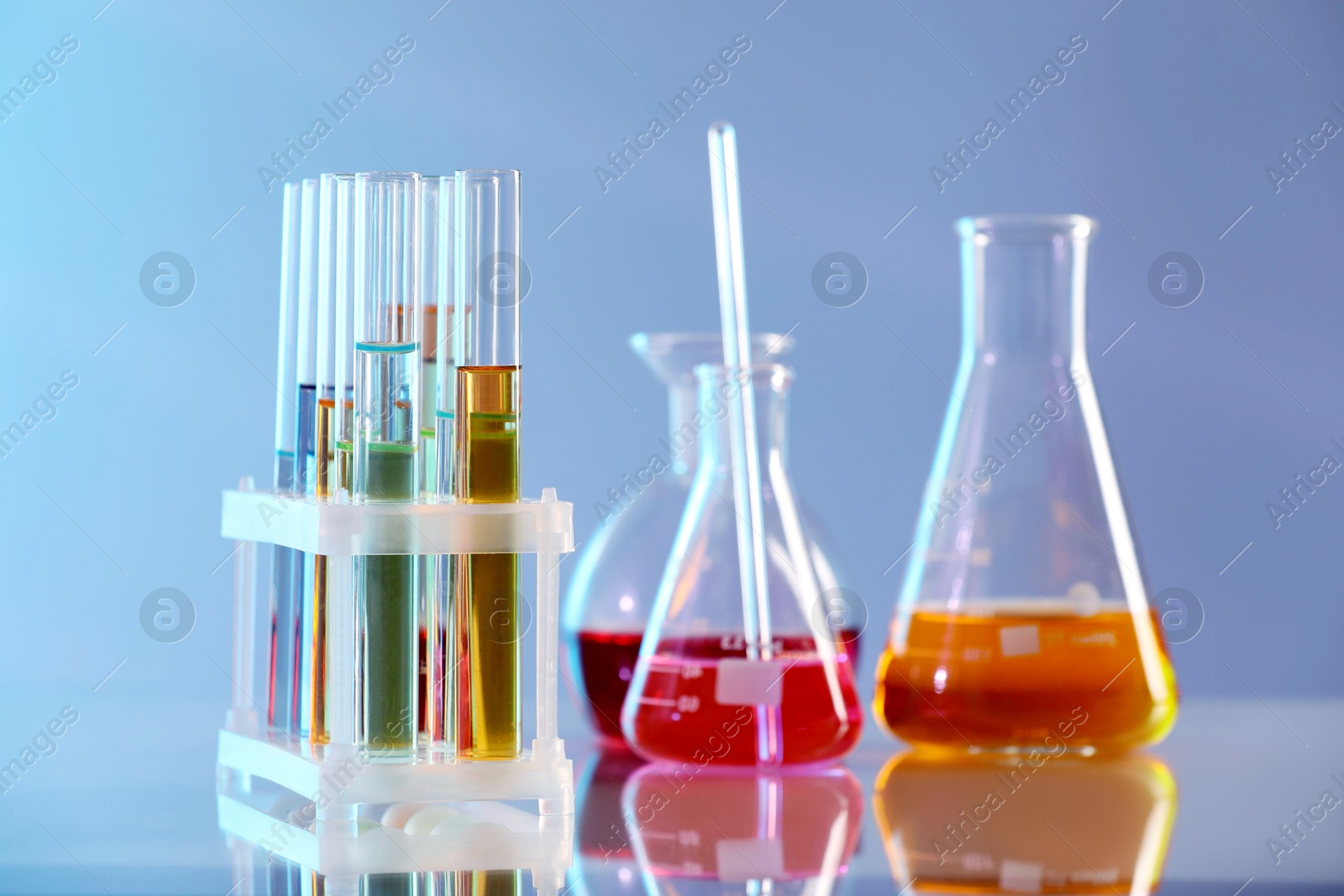Photo of Laboratory glassware with different samples on light table