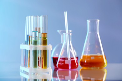 Photo of Laboratory glassware with different samples on light table