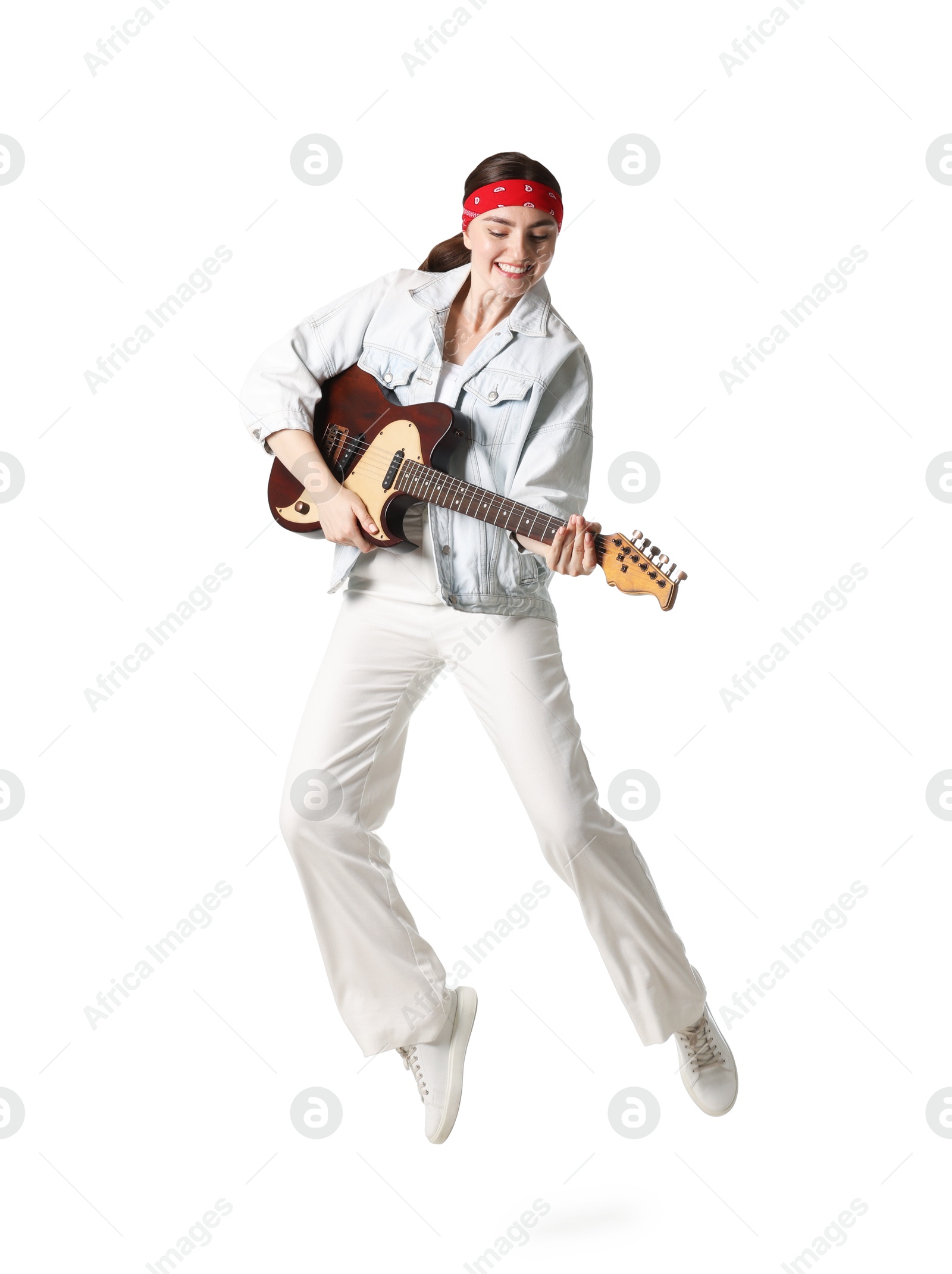 Woman with guitar jumping on white background Photo of Woman with guitar jumping on white background