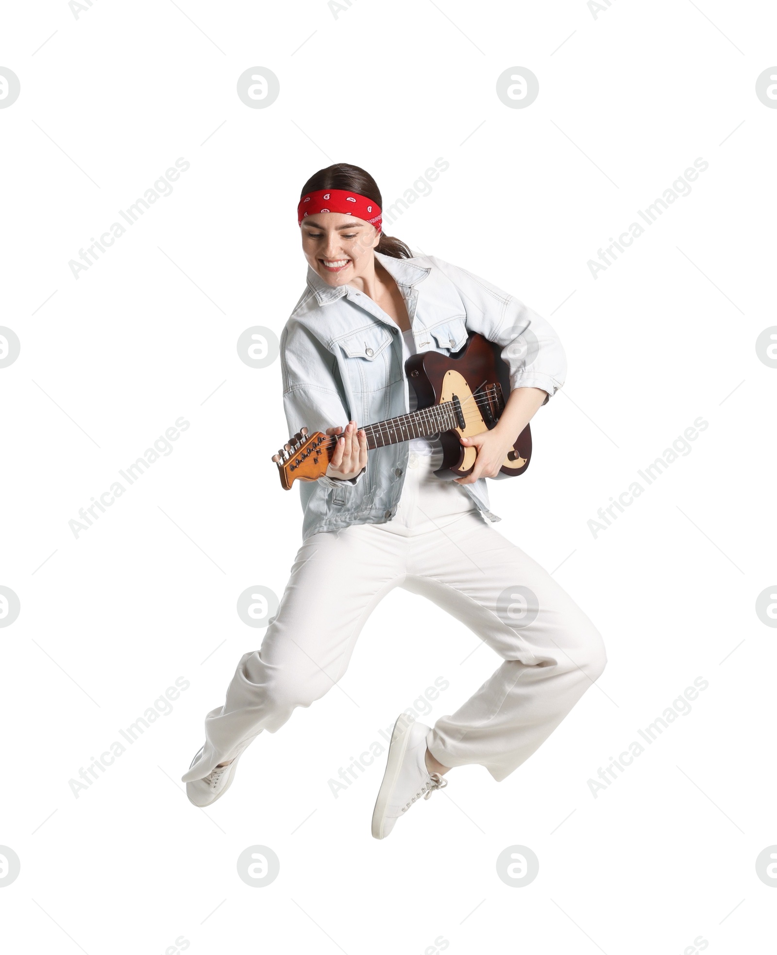 Woman with guitar jumping on white background Photo of Woman with guitar jumping on white background