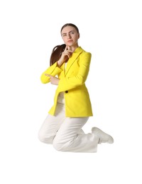 Photo of Woman in yellow jacket jumping on white background