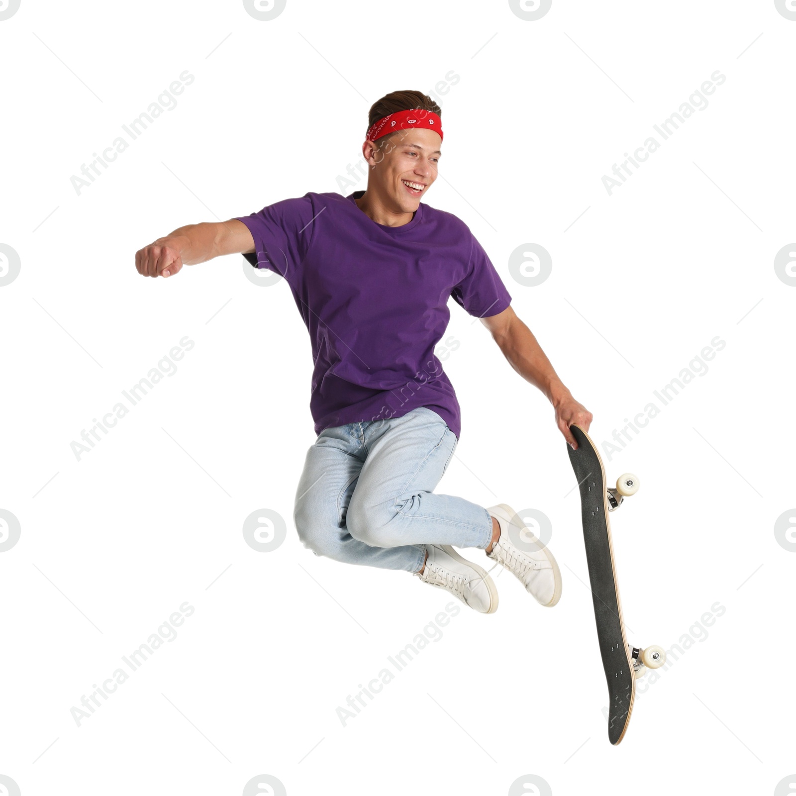 Man with skateboard jumping on white background Photo of Man with skateboard jumping on white background