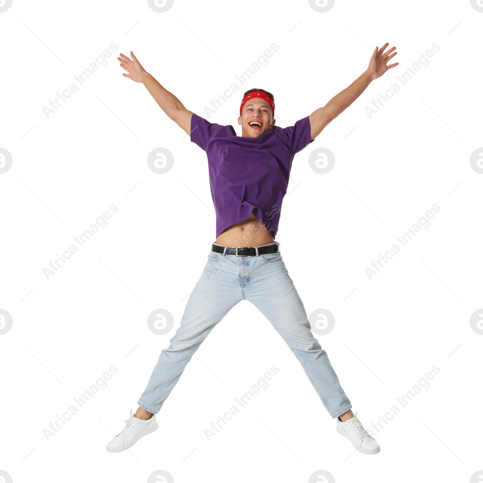 Man in stylish outfit jumping on white background Photo of Man in stylish outfit jumping on white background