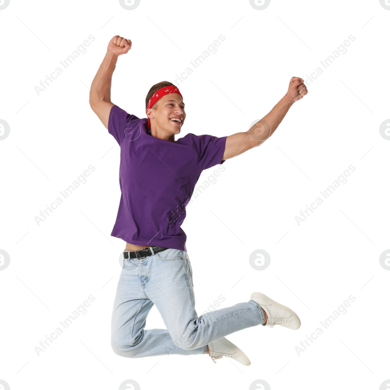 Man in stylish outfit jumping on white background Photo of Man in stylish outfit jumping on white background