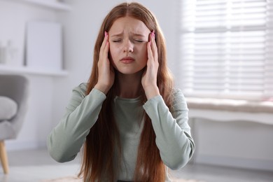 Photo of Teenage girl meditating at home. Way to stop panic attack