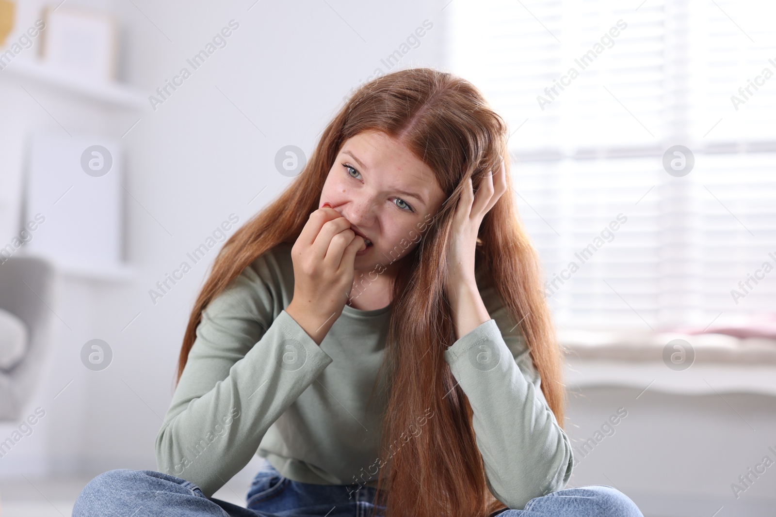 Teenage girl suffering from panic attack at home Photo of Teenage girl suffering from panic attack at home