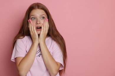Photo of Teenage girl suffering from panic attack on pink background. Space for text