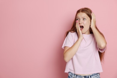 Photo of Teenage girl suffering from panic attack on pink background. Space for text
