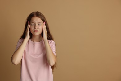 Photo of Teenage girl meditating on beige background, space for text. Way to stop panic attack