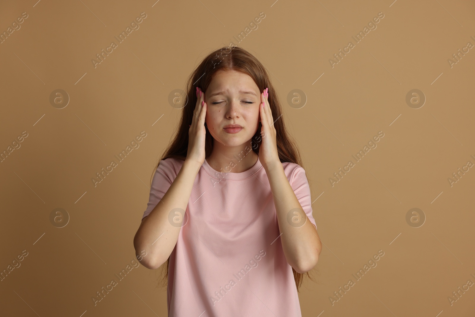 Teenage girl meditating on beige background. Way to stop panic attack Photo of Teenage girl meditating on beige background. Way to stop panic attack