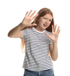 Photo of Teenage girl suffering from panic attack on white background