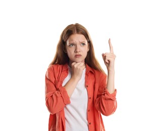 Photo of Teenage girl suffering from panic attack pointing upwards on white background