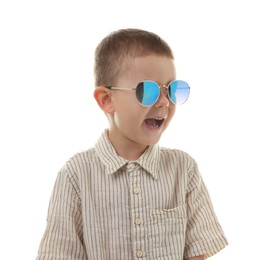 Photo of Cute little boy in sunglasses laughing on white background