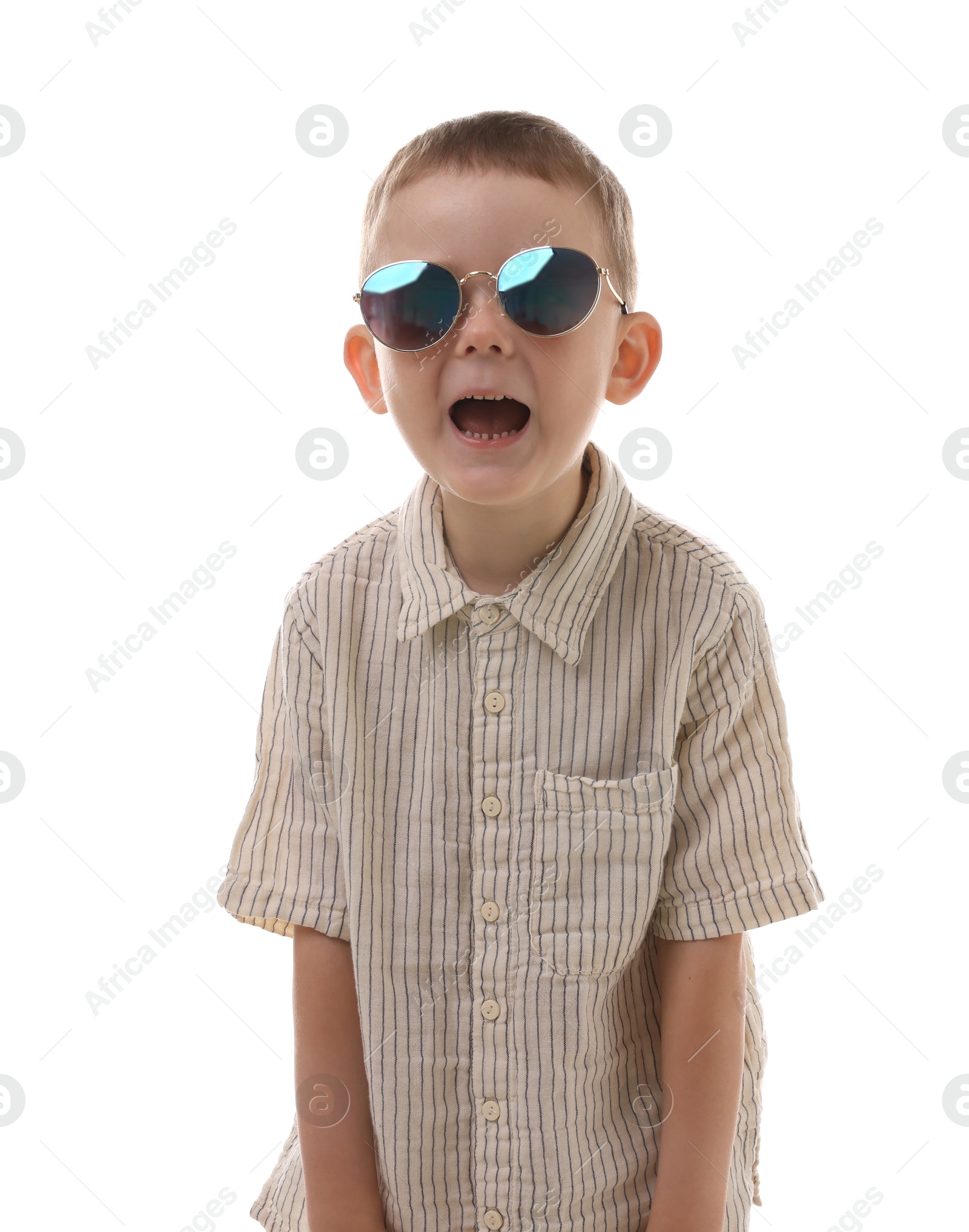 Cute little boy in sunglasses laughing on white background Photo of Cute little boy in sunglasses laughing on white background
