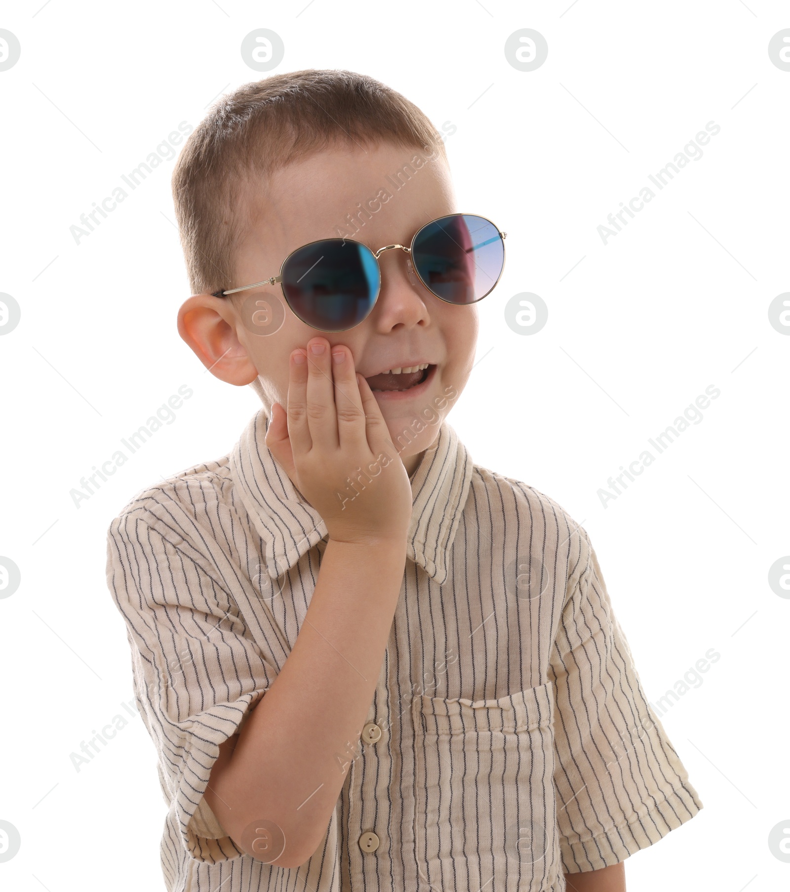 Cute little boy in sunglasses laughing on white background Photo of Cute little boy in sunglasses laughing on white background