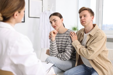 Photo of In vitro fertilization (IVF). Couple having appointment with doctor in reproductive clinic