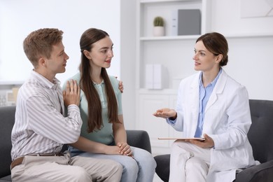Photo of In vitro fertilization (IVF). Couple having appointment with doctor in reproductive clinic