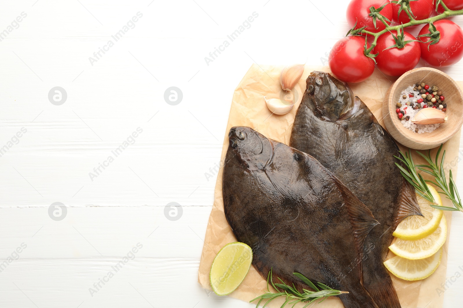 Seafood. Fresh raw flounder fish and ingredients on white wooden table, flat lay. Space for text Photo of Seafood. Fresh raw flounder fish and ingredients on white wooden table, flat lay. Space for text