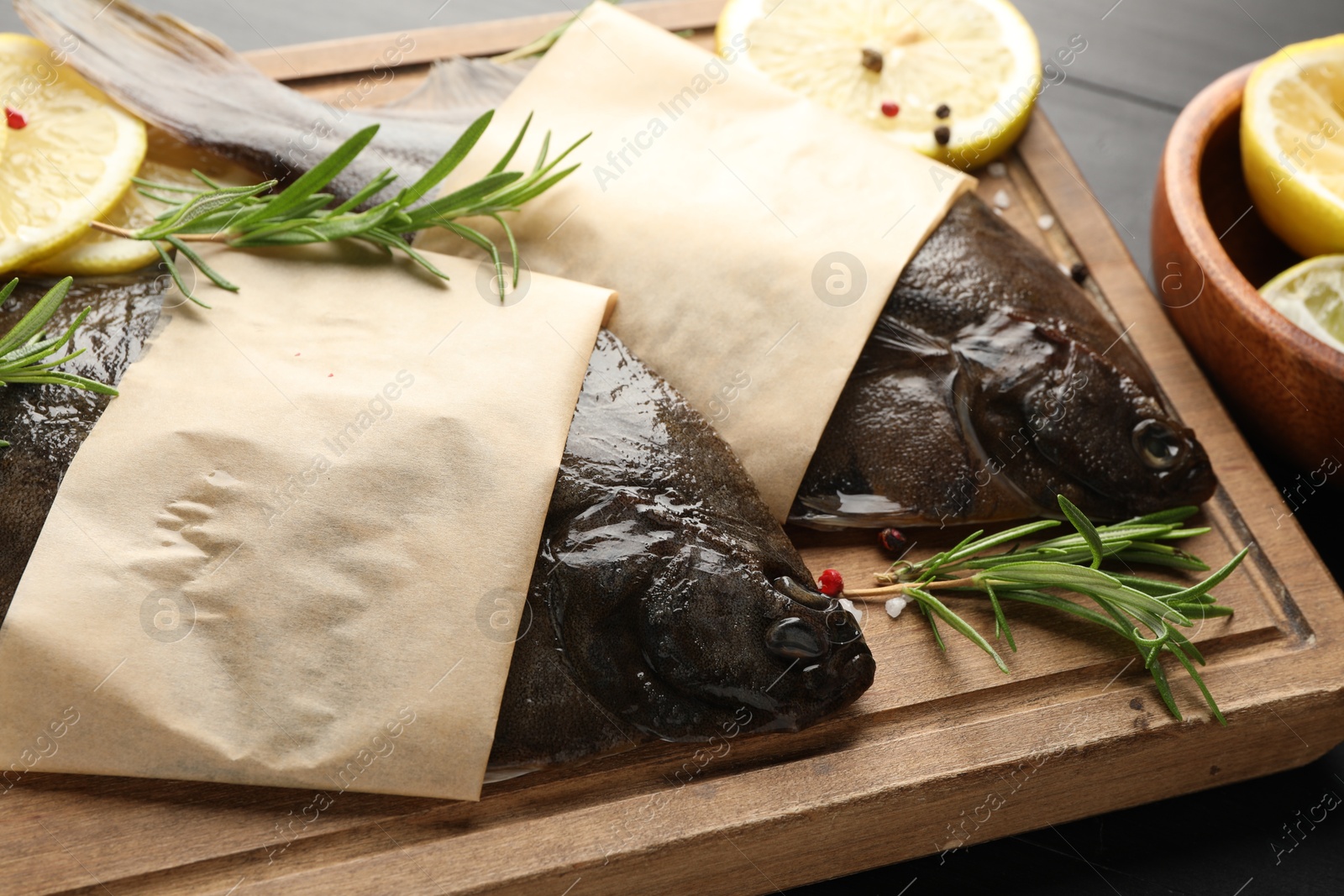 Photo of Fresh raw flounder fish and spices on table, closeup. Seafood