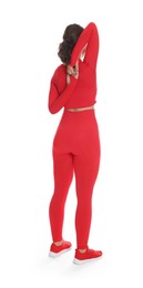Photo of Teenage girl in sportswear stretching on white background, back view