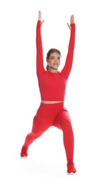 Photo of Teenage girl in sportswear stretching on white background