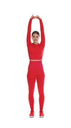 Photo of Teenage girl in sportswear stretching on white background
