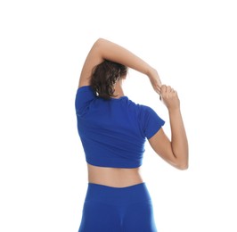 Photo of Teenage girl in sportswear stretching on white background, back view
