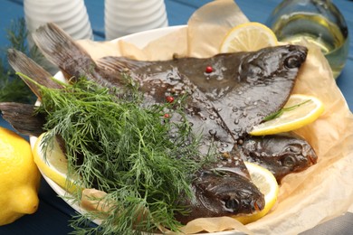 Photo of Fresh raw flounder fish and spices on table, closeup. Seafood